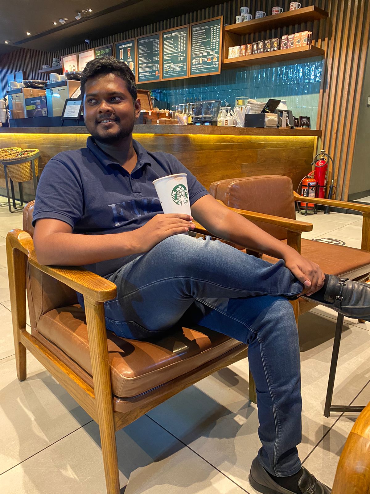 Jevon Max working from a cafe in Chennai, India